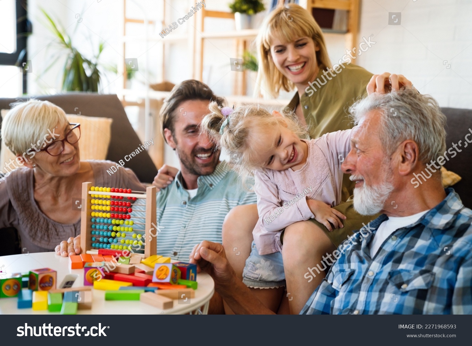 Cheerful multi-generation family having fun while spending time together at home. #2271968593