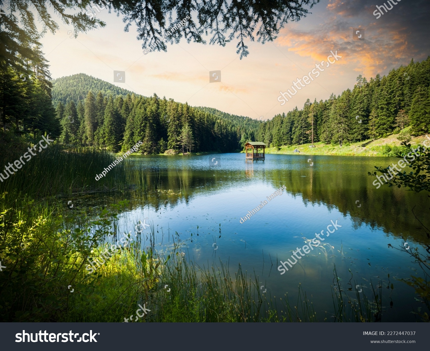 A wonderful view of the lake at sunrise. Shiin mountain lake in camping and picnic area. Spring season nature background #2272447037