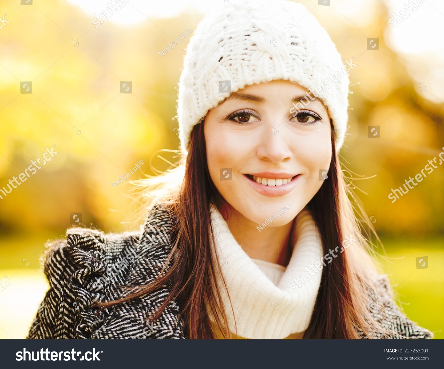 Beautiful girl smiling and enjoying winter sunshine #227253001
