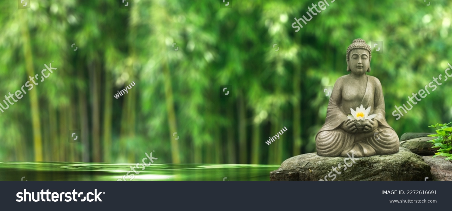 buddha statue on a rock in a blurred green bamboo jungle with smooth water surface, fresh natural spa wallpaper concept with asian spirit and copy space #2272616691