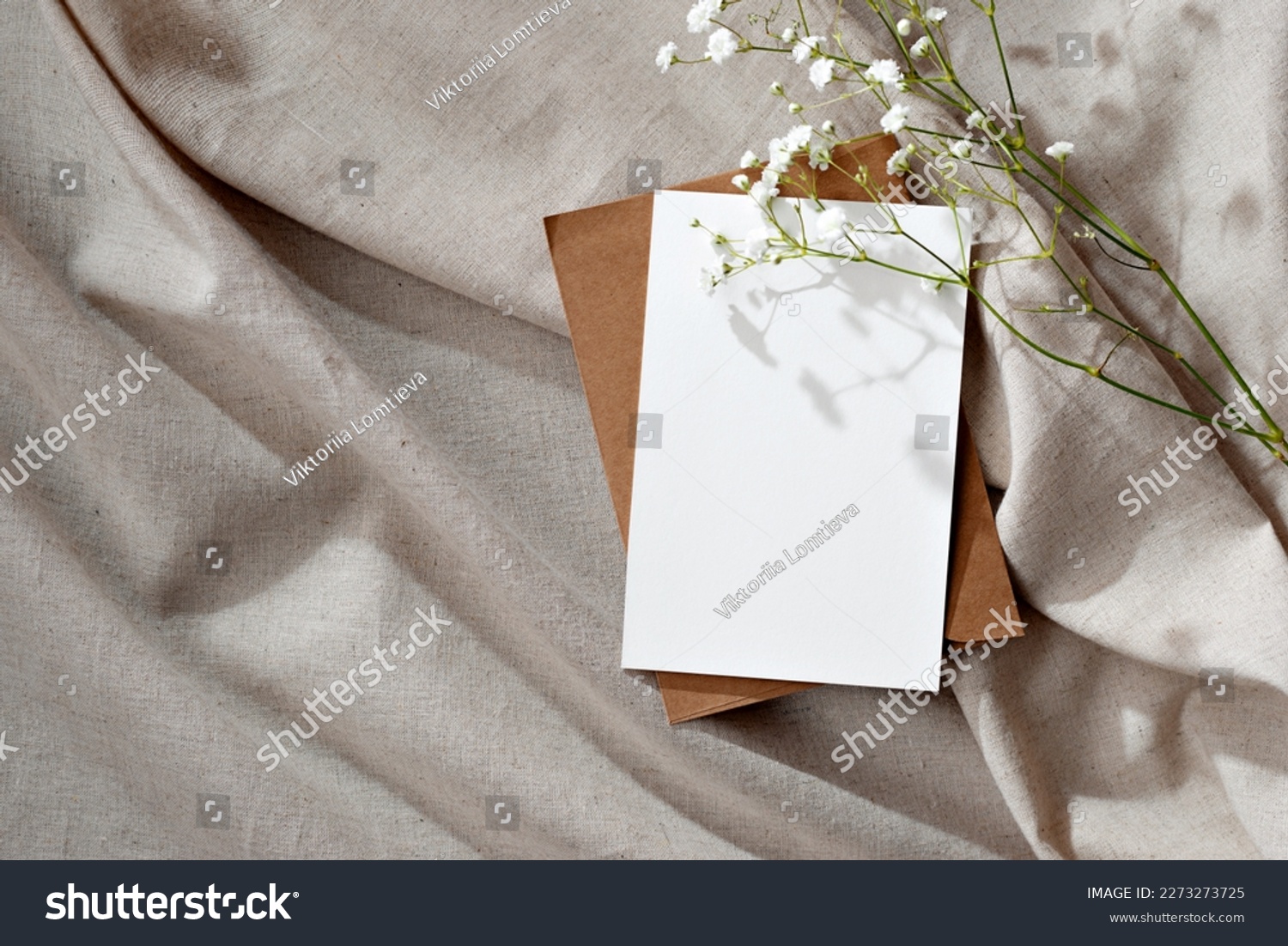 Minimalist floral wedding invitation or greeting card, postcard template, blank paper card and flowers on a beige neutral linen background #2273273725