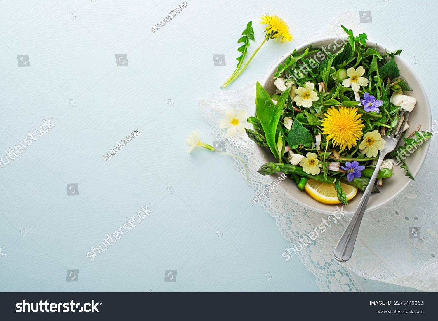 Spring salad with dandelion, asparagus, wild garlic, flowers, nettle and cream cheese. Healthy spring detox food ingredients. #2273449263