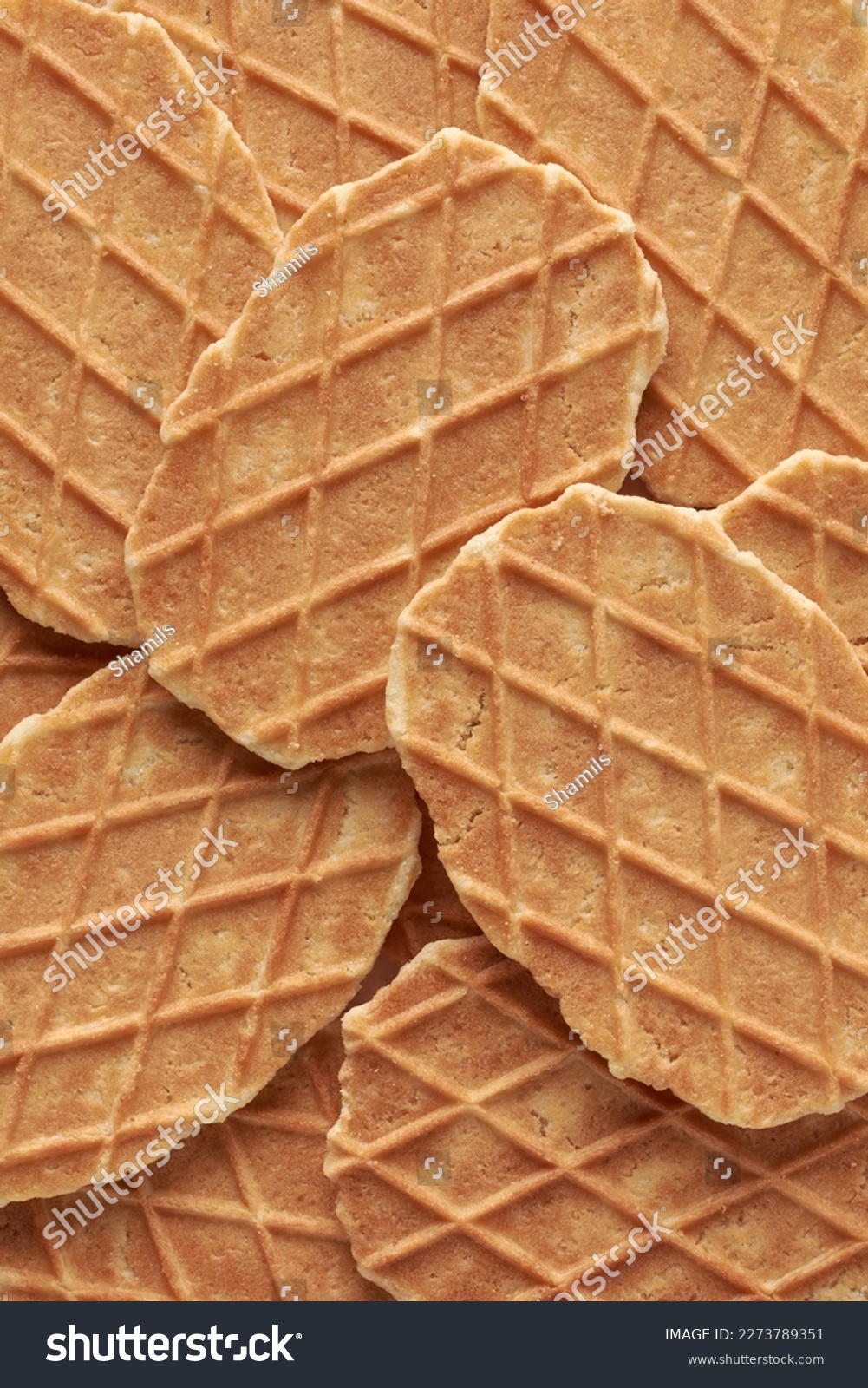 waffles, crunchy cookies snacks in full frame, sweet delicious wafer food background texture, close-up view taken straight from above #2273789351