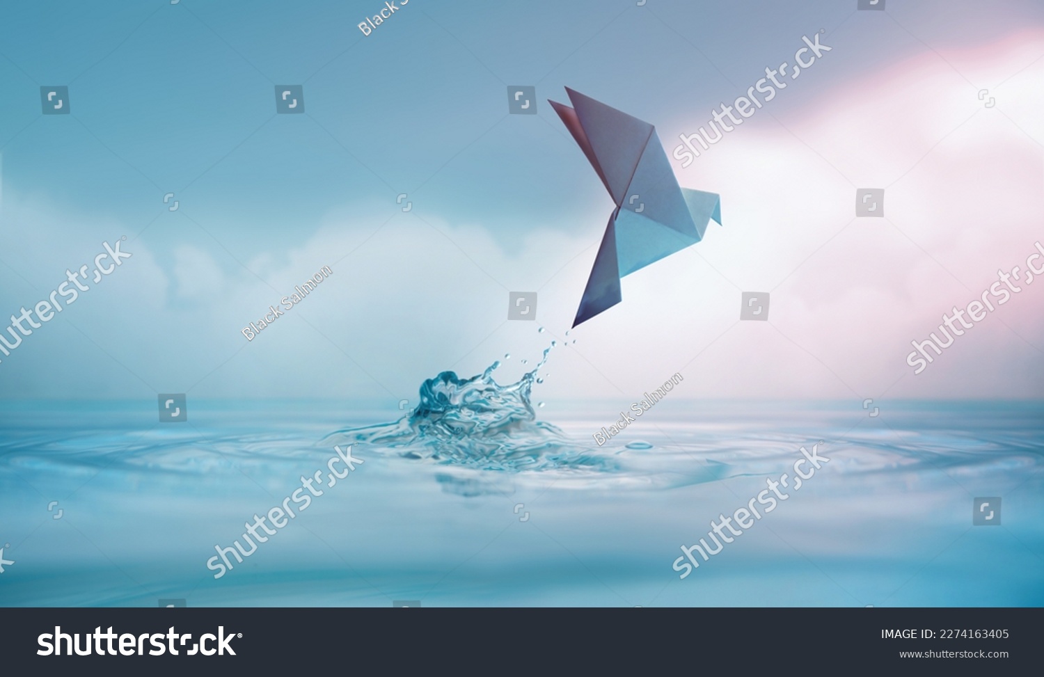 Peace concept. Conceptual photos to show the Freedom of White Origami Dove or Pigeon Flew from the Water into the Sky. International World Peace day, Human Rights, Love and Hope #2274163405