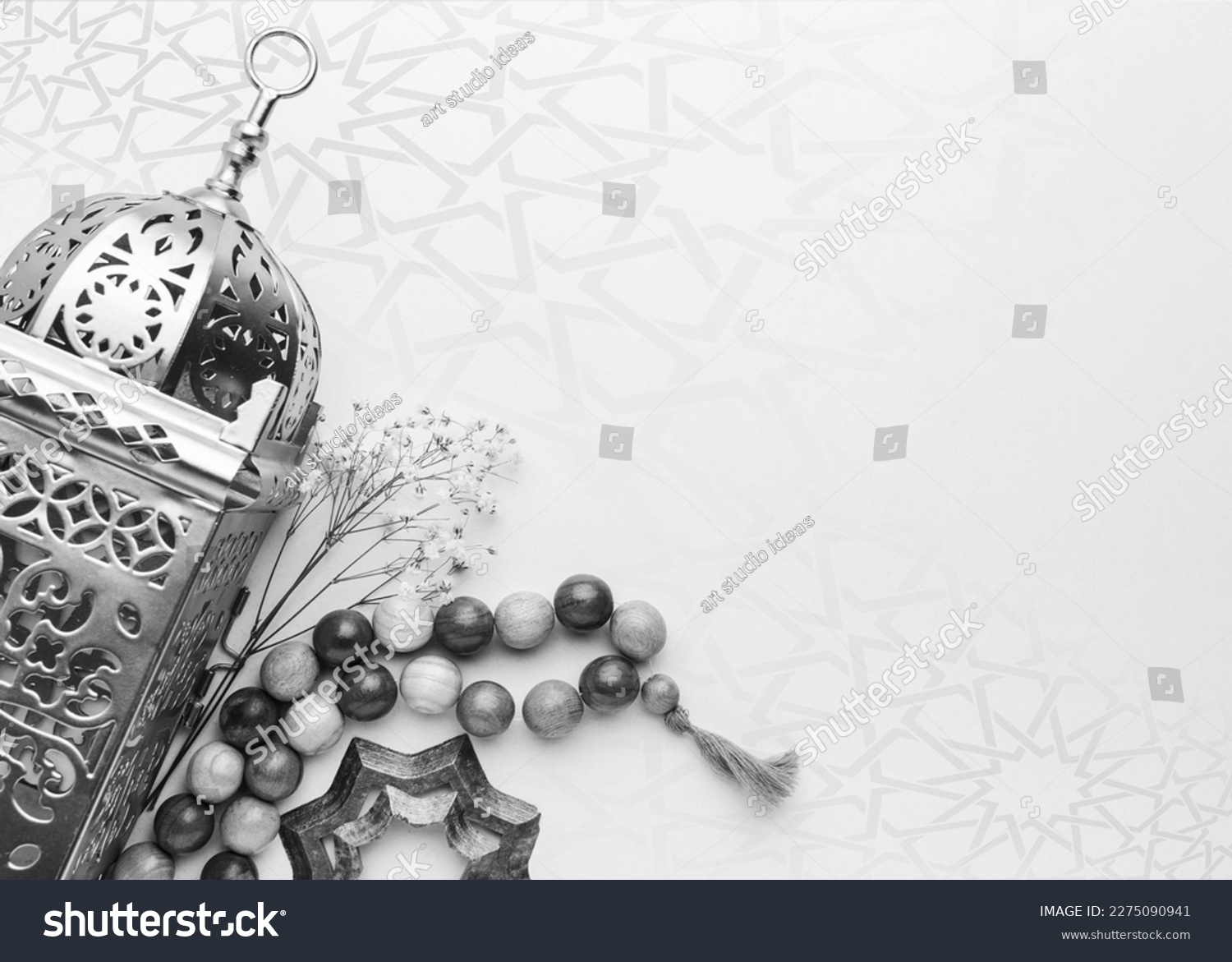 A black and white photo of a lamp and beads with copy space islamic ramadan greeting background . Ramadan Kareem. Islamic greeting template with ramadan for wallpaper design #2275090941