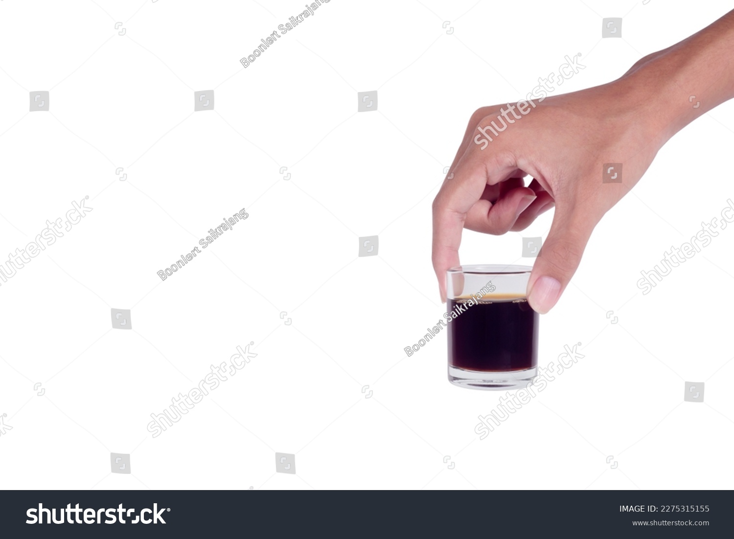 Hand-hold mini glass cup of americano coffee isolated on a white background. #2275315155
