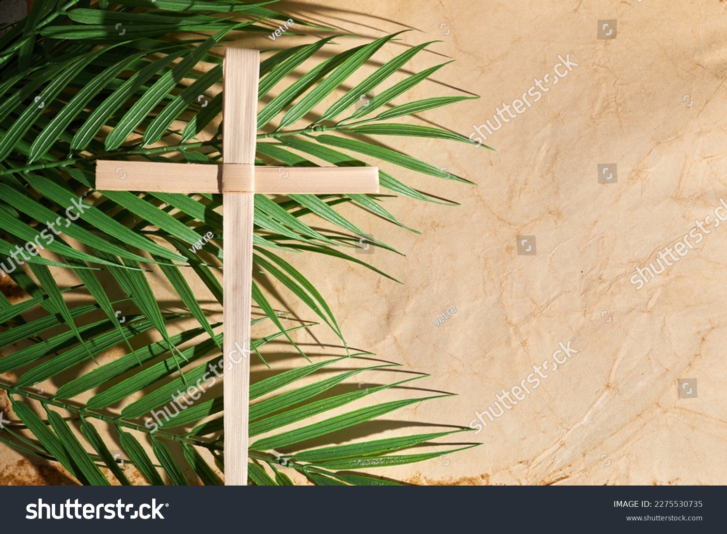 Palm sunday background. Cross and palm on vintage background. #2275530735