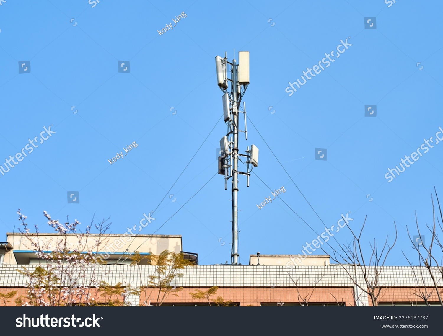 Telecom signal transmitting base station on the roof of a residential building in Chengdu, China #2276137737