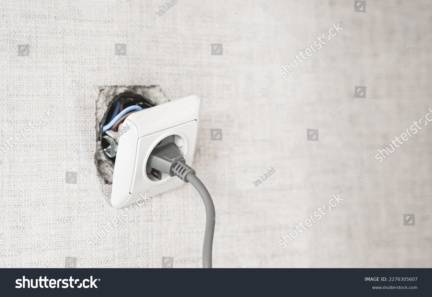 Dangerous bad,broken socket,plug in bathroom,falling out of wall. Outlet installation in old apartment. Poor electrical wire,repair.Terrible do-it-yourself repairmen.Short circuit risk,electric shock. #2276305607