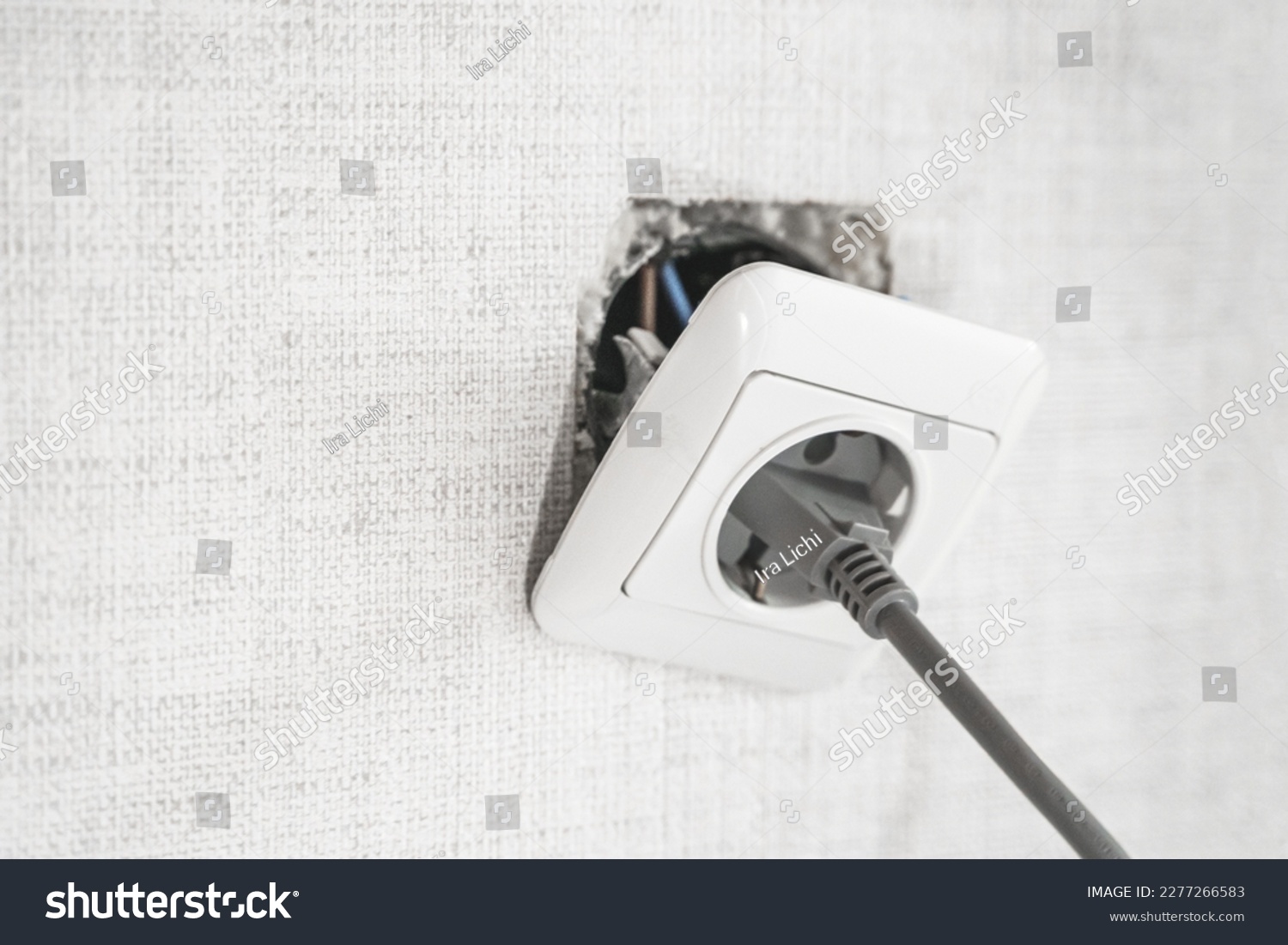 Dangerous bad,broken socket,plug in bathroom,falling out of wall. Outlet installation in old apartment. Poor electrical wire,repair.Terrible do-it-yourself repairmen.Short circuit risk,electric shock. #2277266583