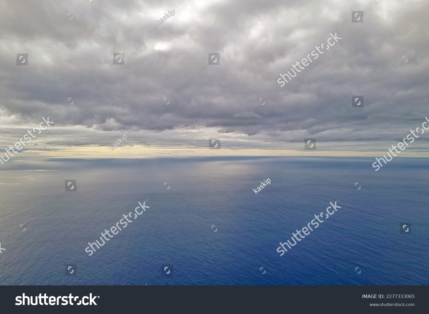 View of the ocean and overcast skies. The background of nature #2277333065