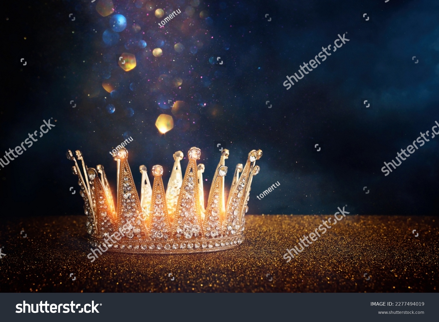 low key image of beautiful queen or king crown over glitter table. fantasy medieval period #2277494019