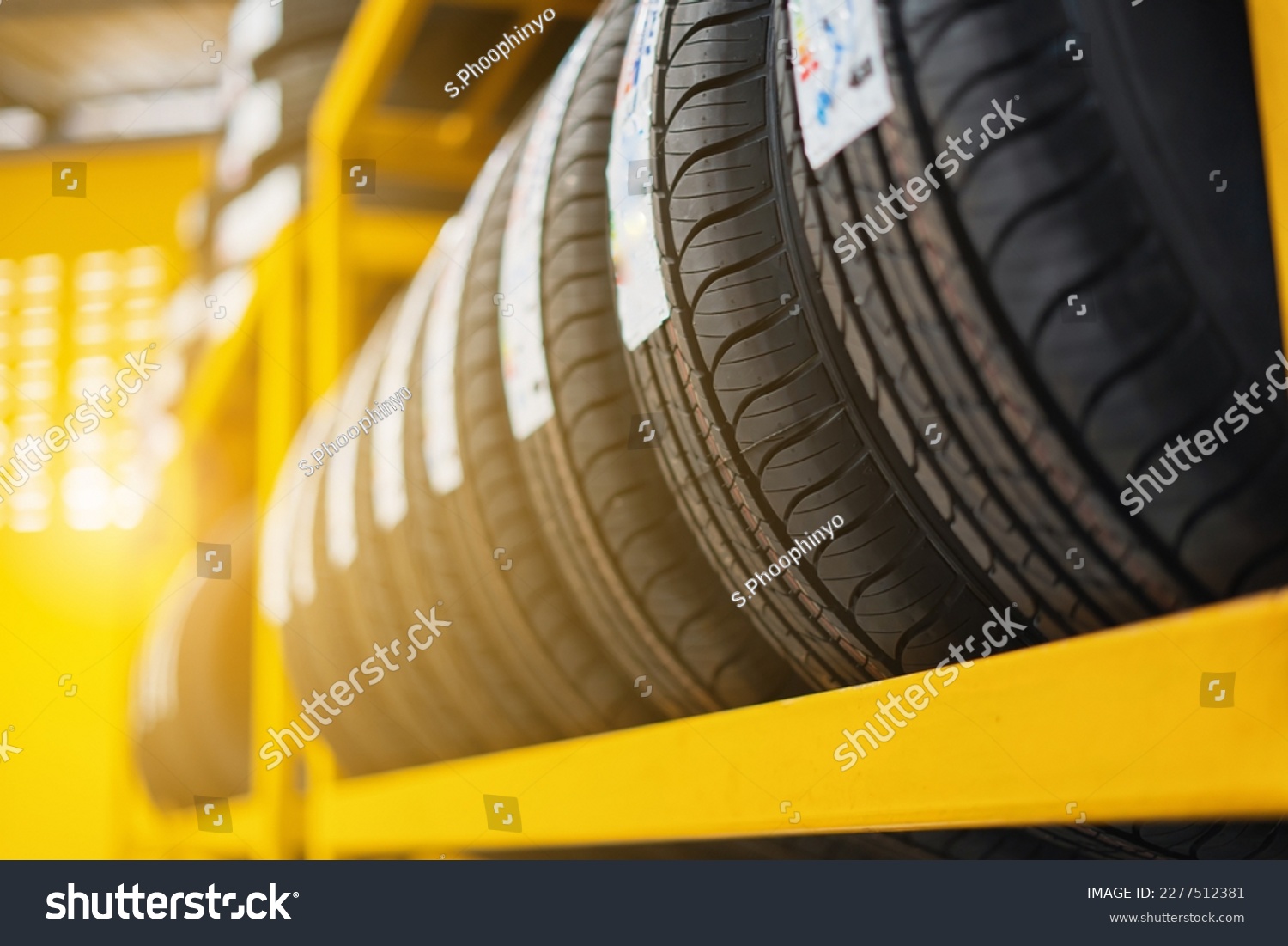 Close-up shot of tires in the warehouse of a tire change center Tire warehouse concept #2277512381