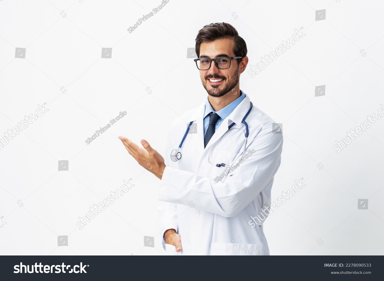 Man portrait of a doctor wearing a white coat and eyeglasses and a stethoscope looking into the camera on a white isolated background, copy space, space for text, health #2278090533