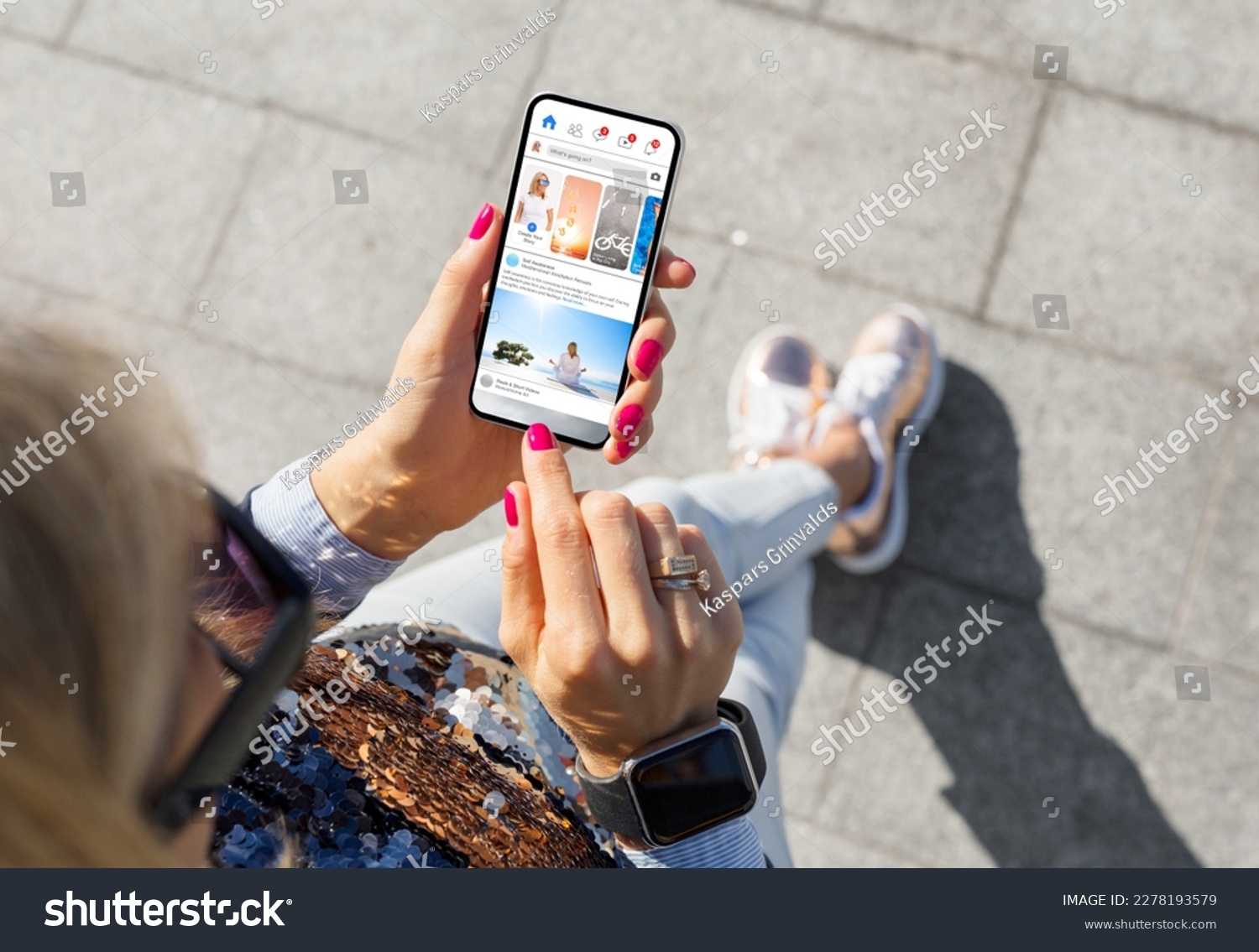 Woman using social media app on mobile phone #2278193579