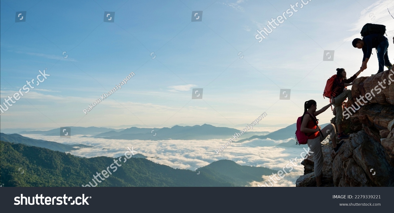 Asian hiking help each other on mountains view . teamwork concept #2279339221