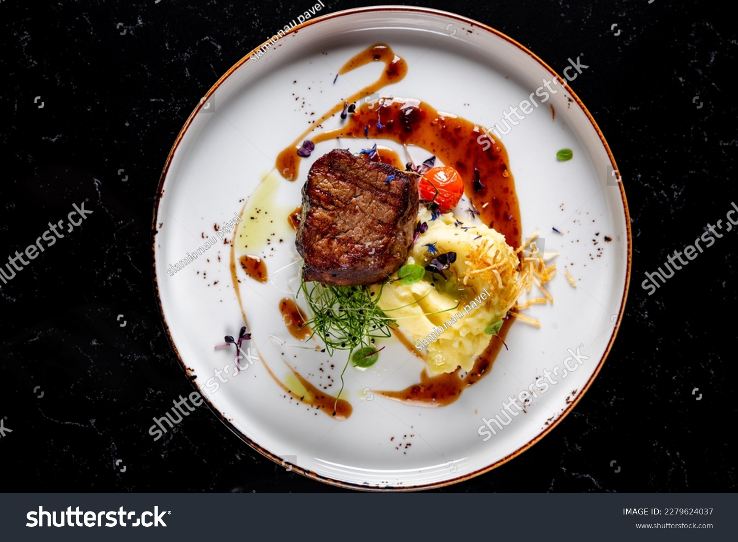 Grilled beef steak filet mignon with potato and sauce in plate #2279624037
