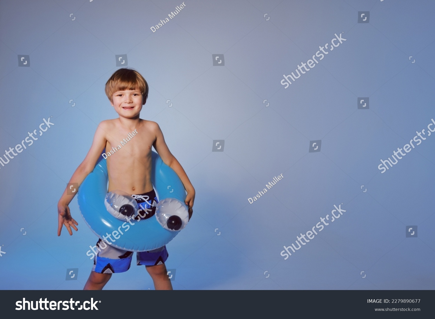 Happy cute baby boy 6-7 years old  with a life buoy. Summer and the sea. #2279890677