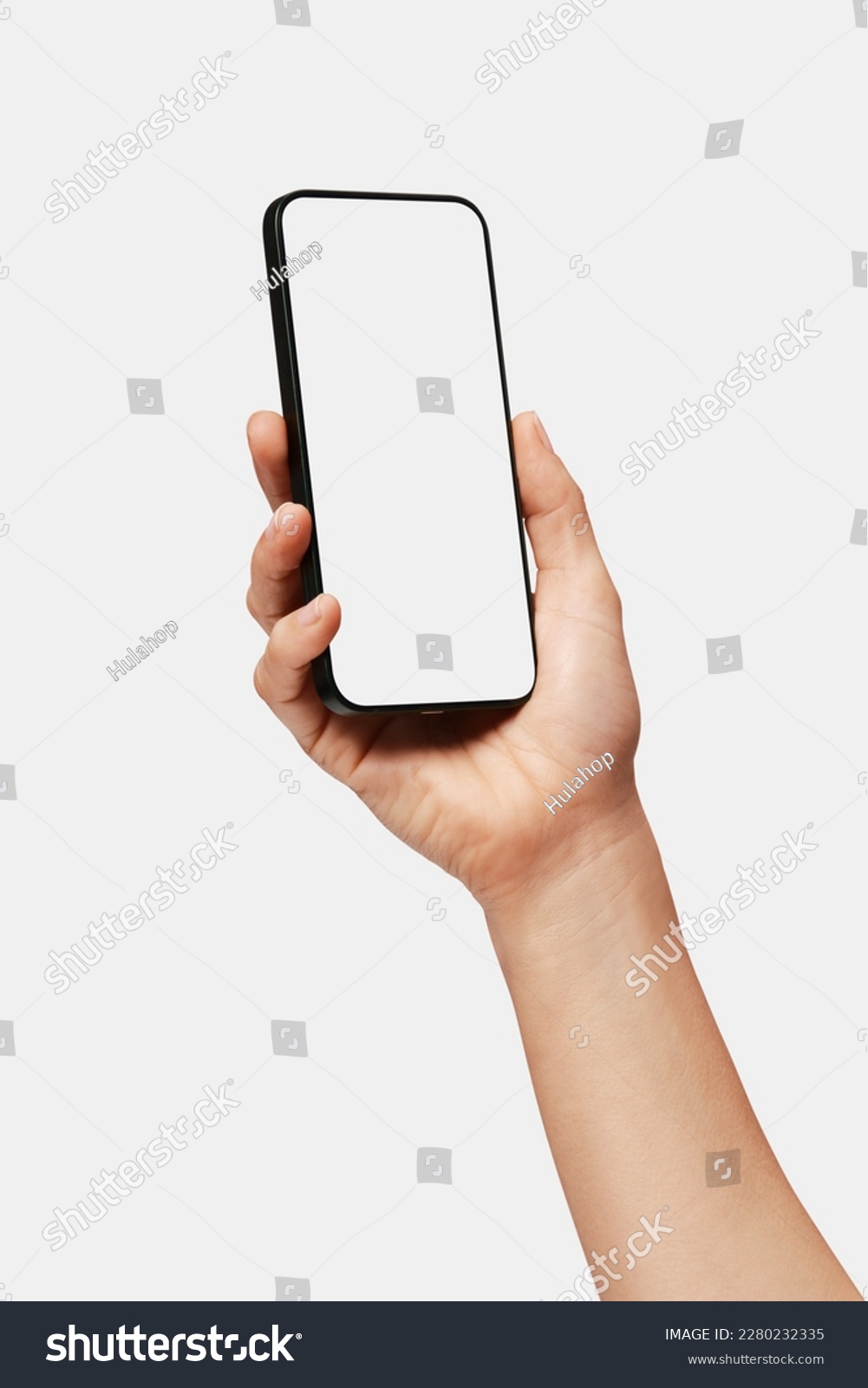 Close up of woman hand holding modern smart phone mockup. New modern black frameless smartphone mockup with blank white screen. Isolated on white background high quality studio shot Modern smart #2280232335