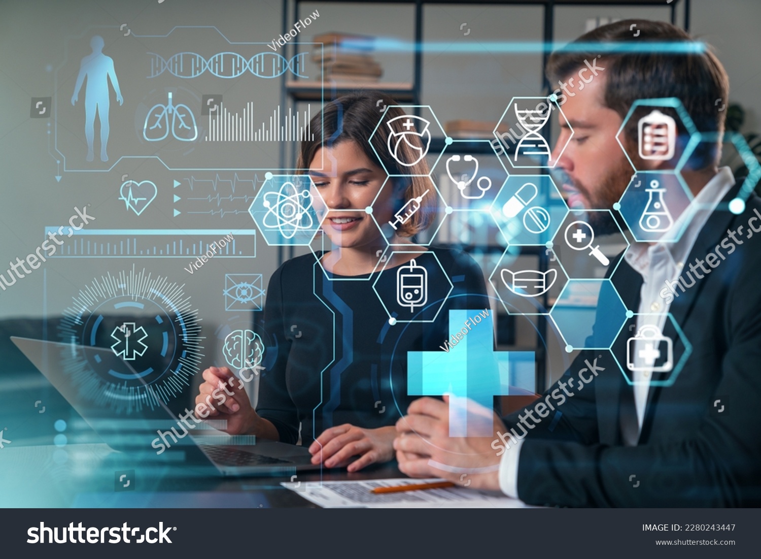 Thoughtful businesspeople typing on laptop at office workplace. Concept of team work, business education, internet surfing, brainstorm, project information technology. Medical healthcare hologram #2280243447