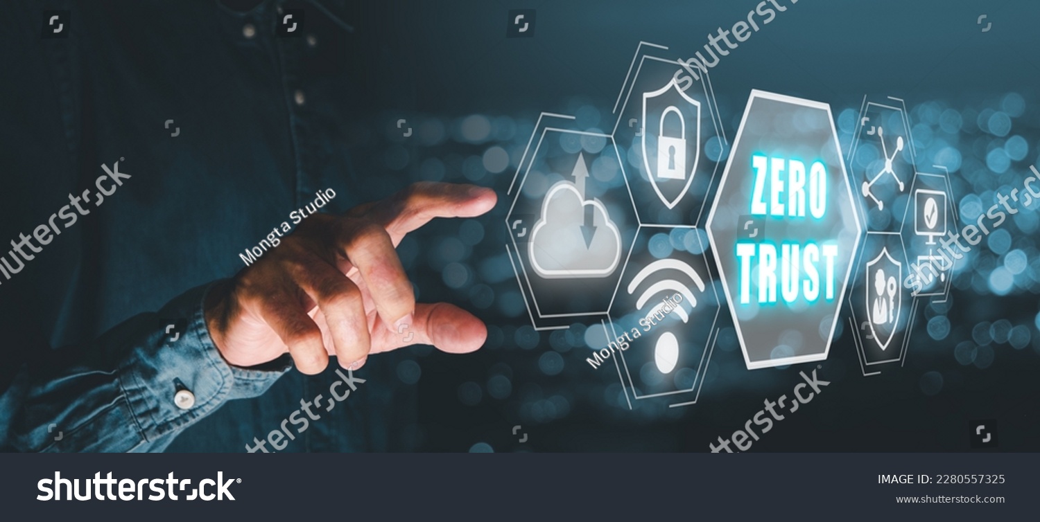 Zero trust security concept, Person hand touching zero trust icon on virtual screen. with blue bokeh background #2280557325
