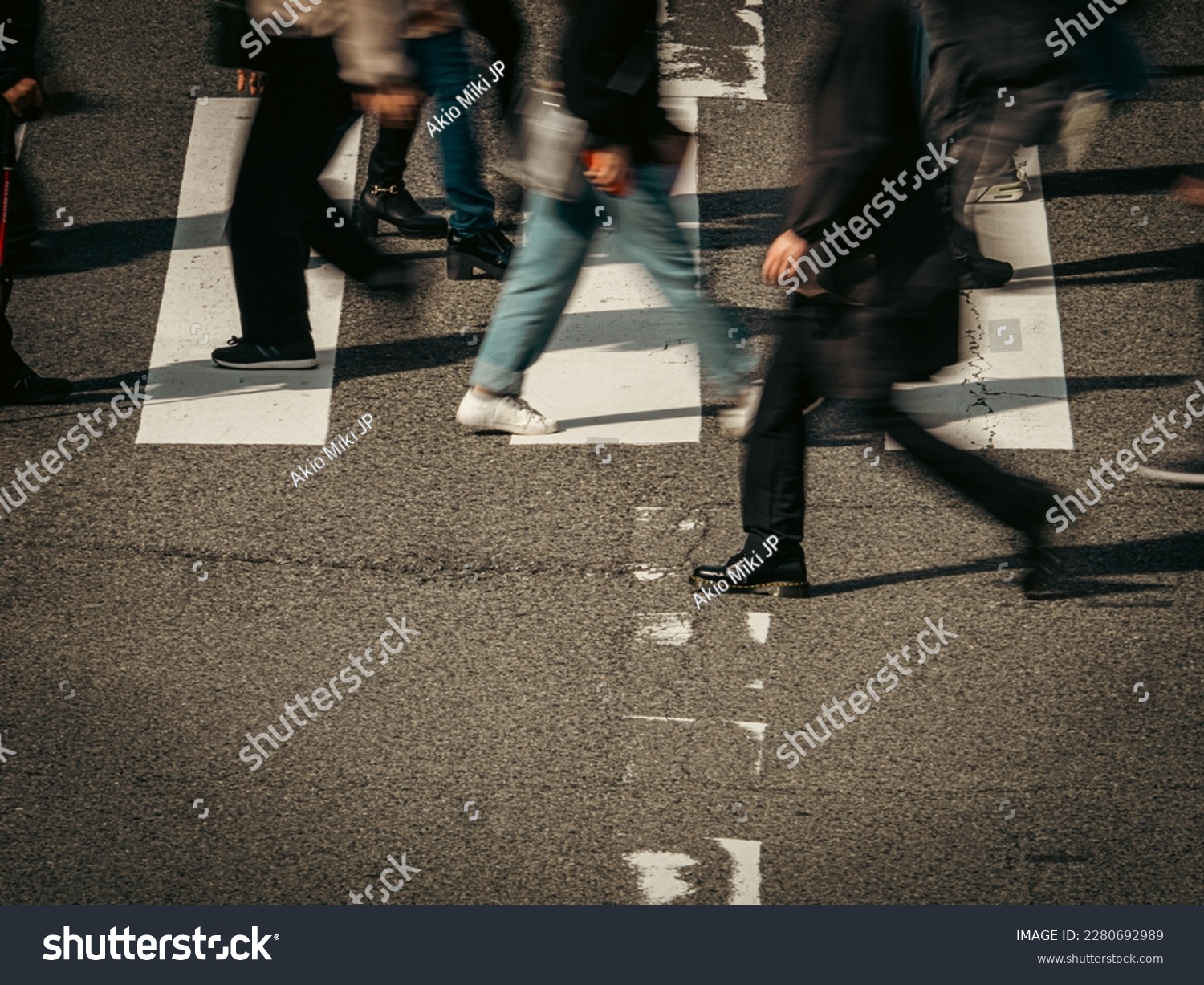 People crowd walking on a pedestrian crossing, City of Osaka in Japan, Business or work background, Blurred image #2280692989