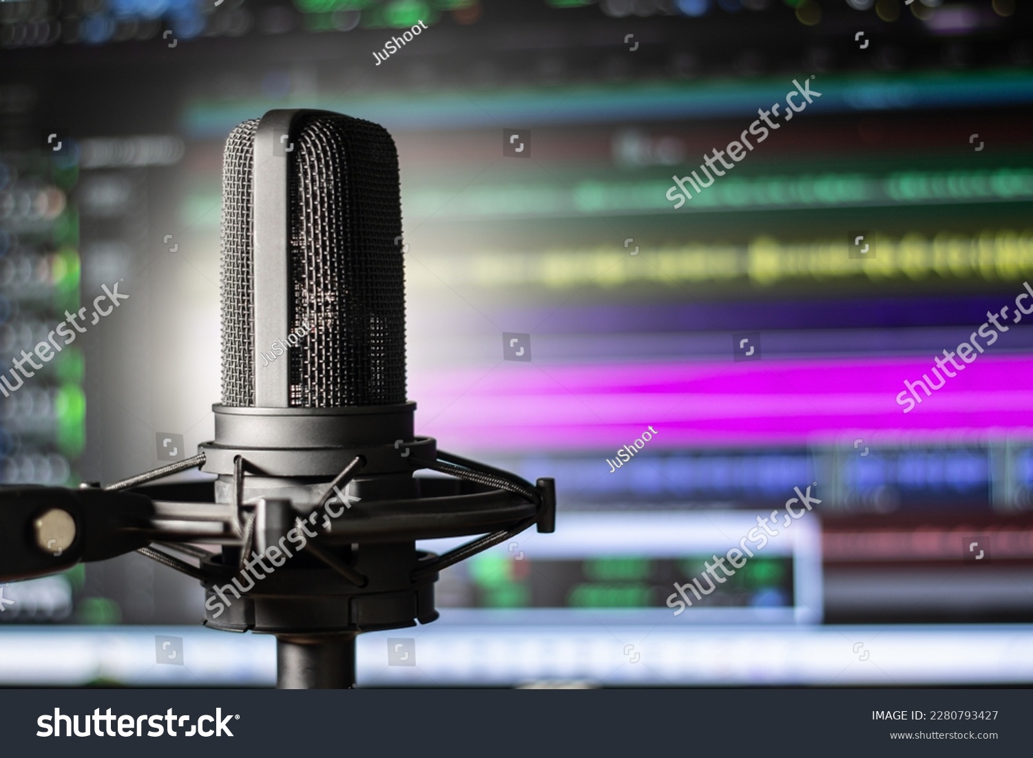 Recording studio vocal microphone with audio editing background. Colorful home studio session with mic and computer. #2280793427