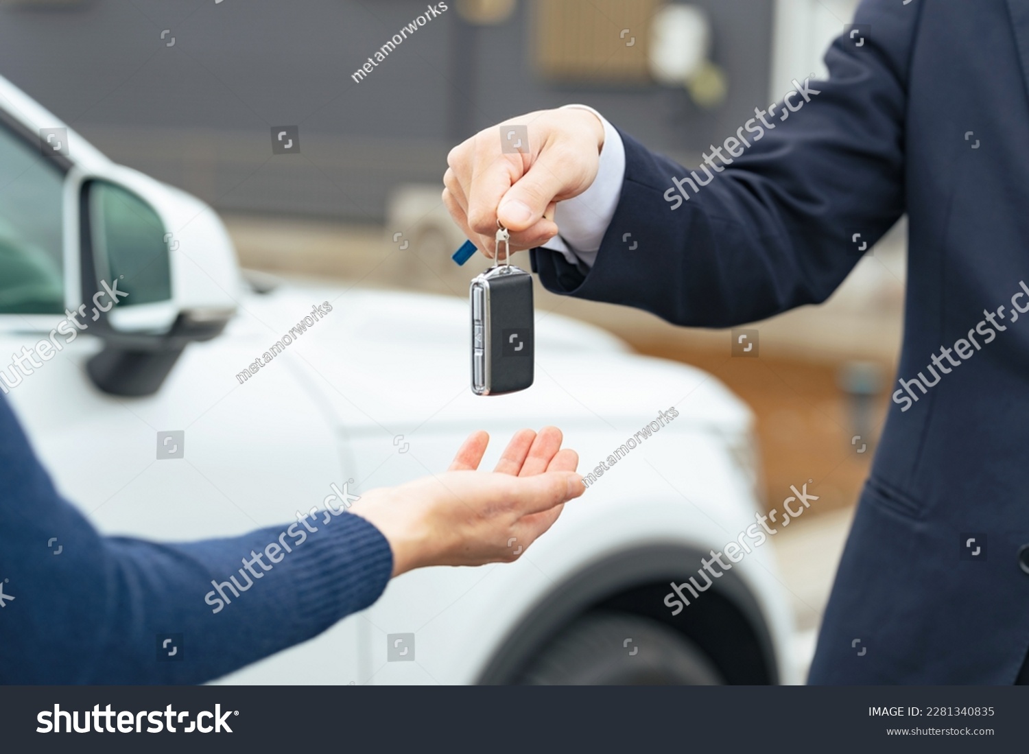 Man handing car smart key. Car rental. Car sharing. #2281340835