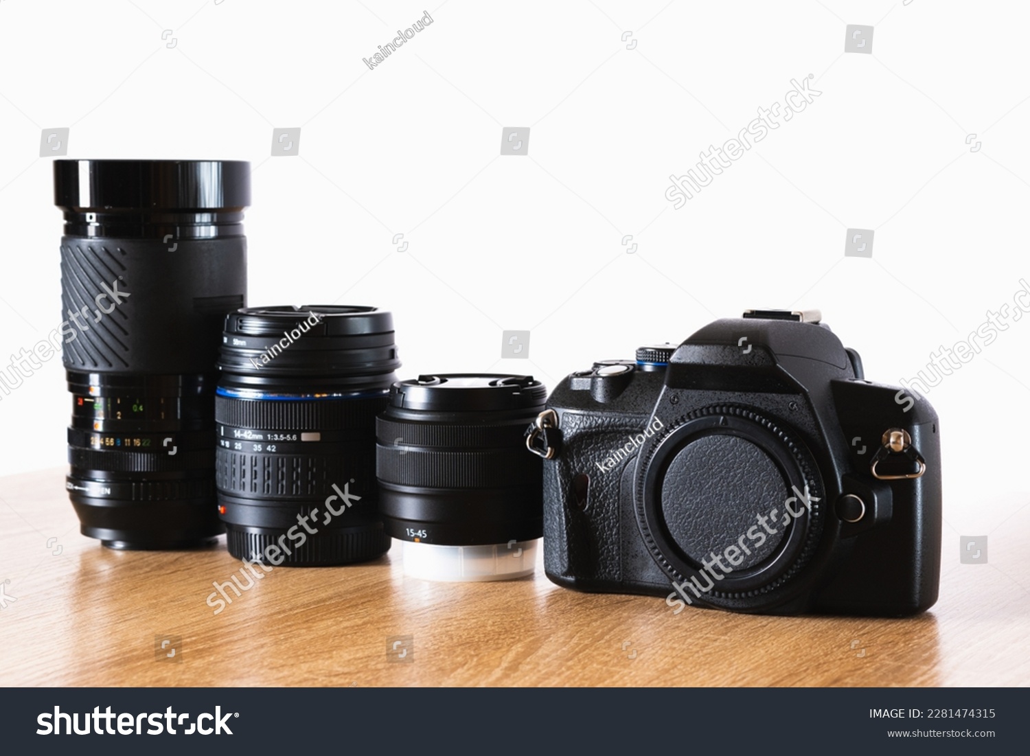 Photographic equipment kit, camera and photographic lenses lined up on wooden table, horizontal photography, photography theme, visual communication, side view #2281474315