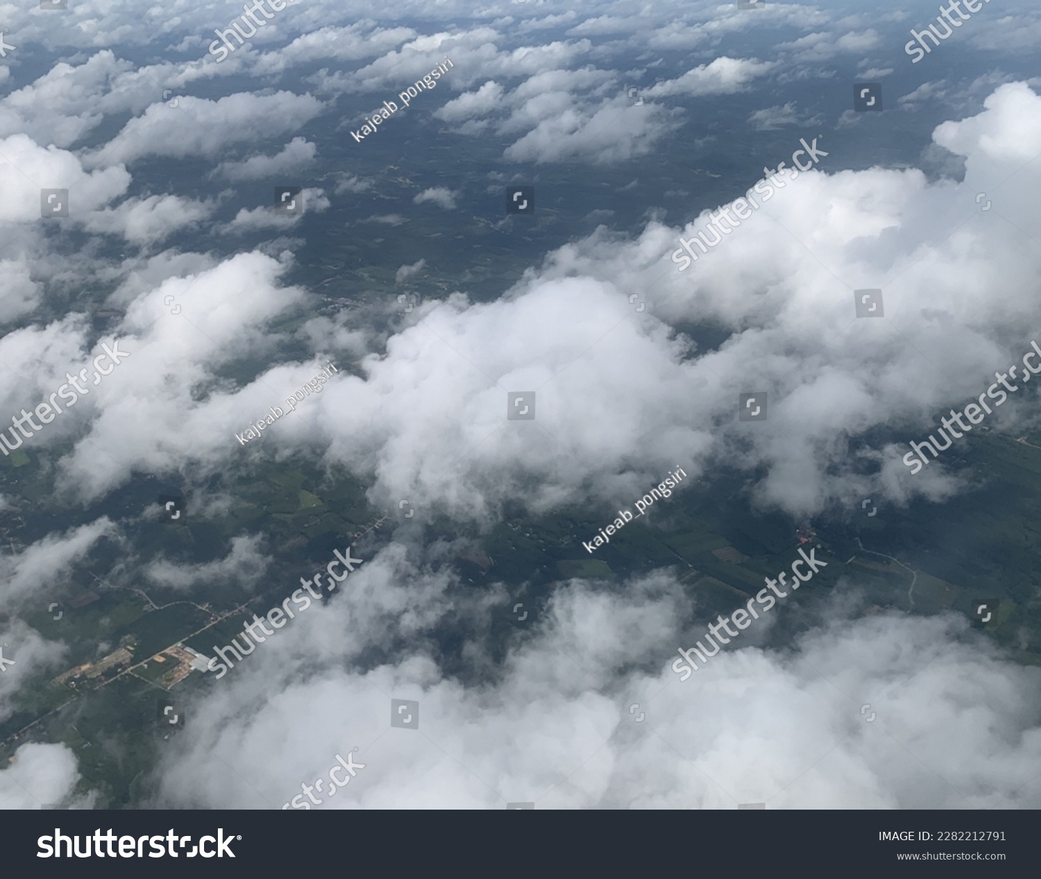 High-angle photo from an airplane, White Stratocumulus clouds float like cotton wool above the beautiful sky at Trang, Thailand.no focus #2282212791