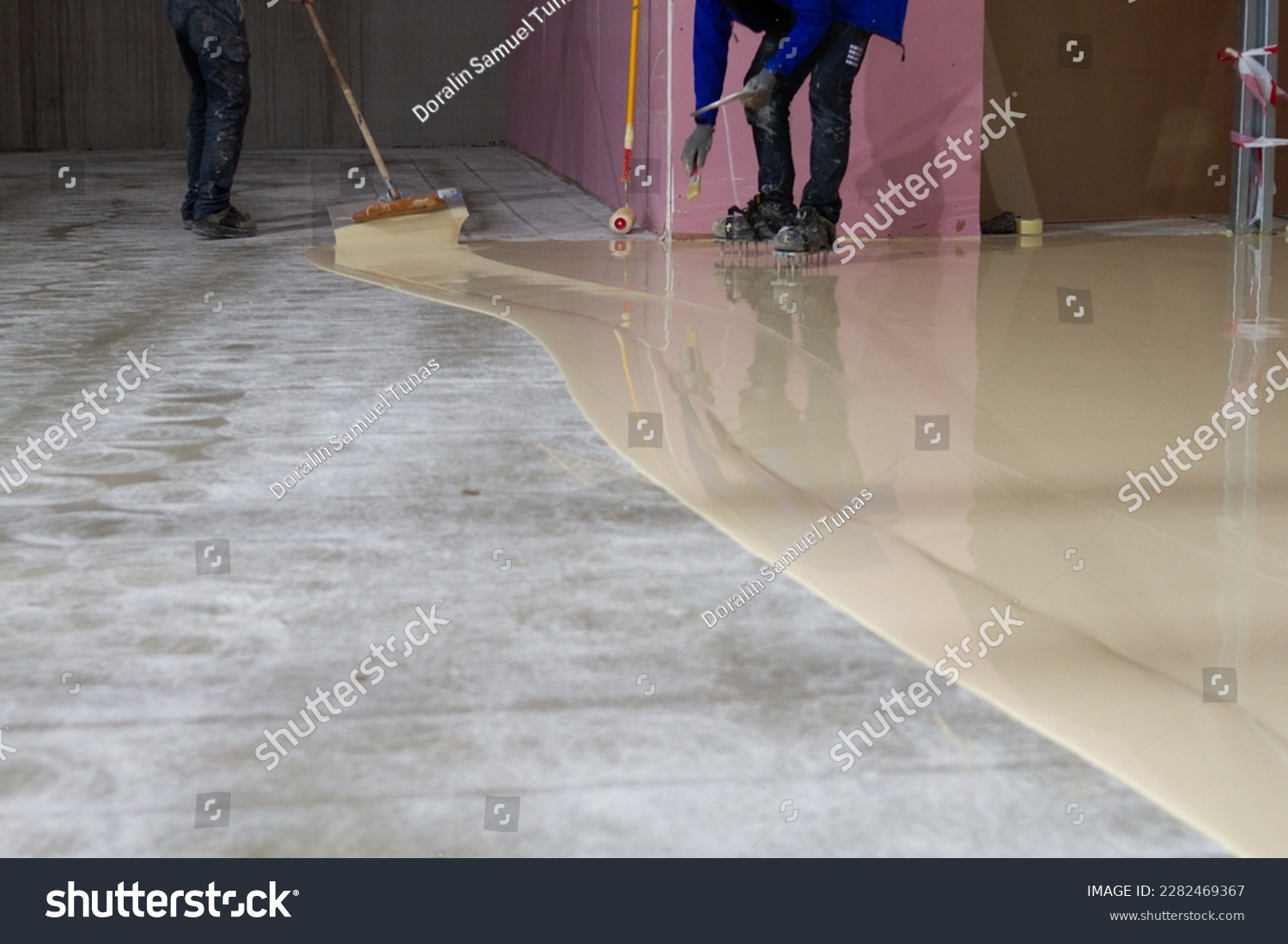 The worker who applied the resistant epoxy resin in the new hall was highly skilled and experienced in the application of epoxy coatings.  #2282469367