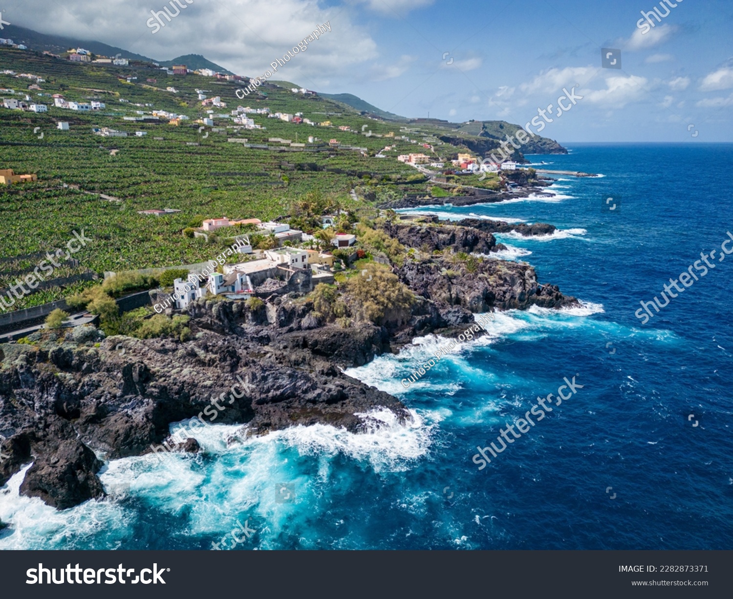 Aerial View at San Andres village near Los Sauces at northeast of La Palma Island. Green Volcanic Hills, and the Coast of the Atlantic Ocean. Canary Islands, Spain.  #2282873371
