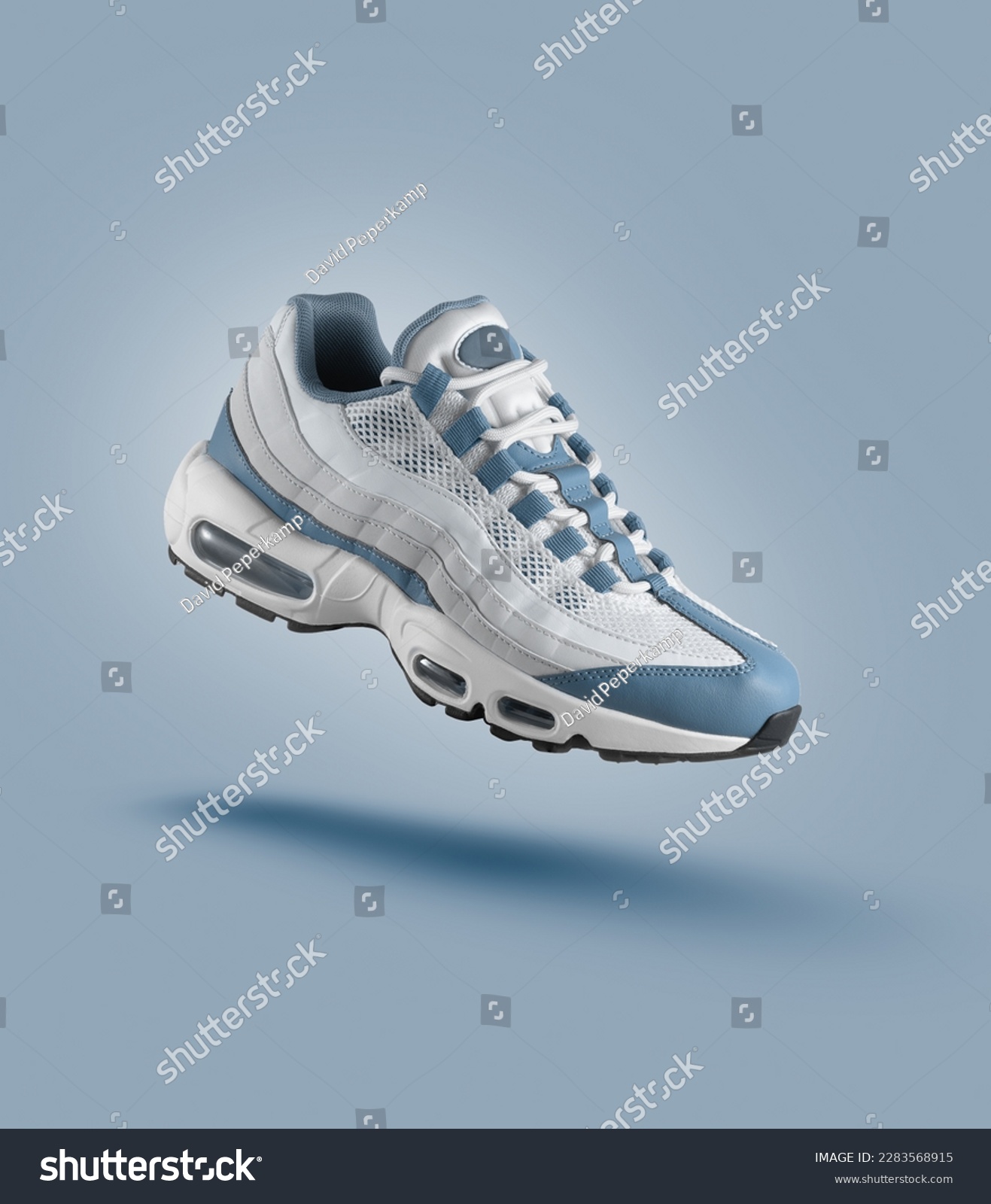 White sneaker with light blue accents on blue gradient background, sport concept, men's fashion, sport shoe, air, sneakers, lifestyle, concept, product photo, levitation concept, street  #2283568915