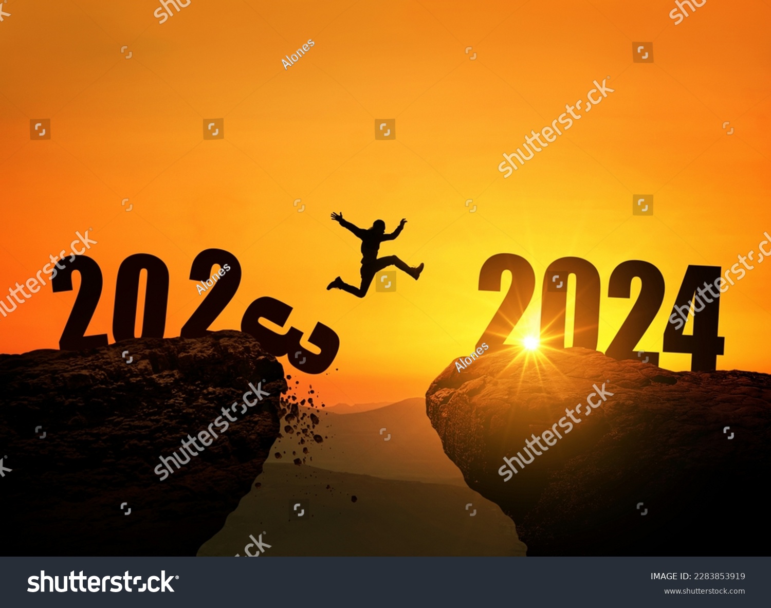 Man jumping on cliff 2024 over the precipice with stones at amazing sunset. New Year's concept. 2023 falls into the abyss. Welcome 2024. People enters the year 2024, creative idea. #2283853919