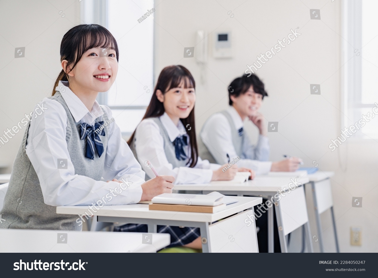 High school students enjoying class in a classroom #2284050247
