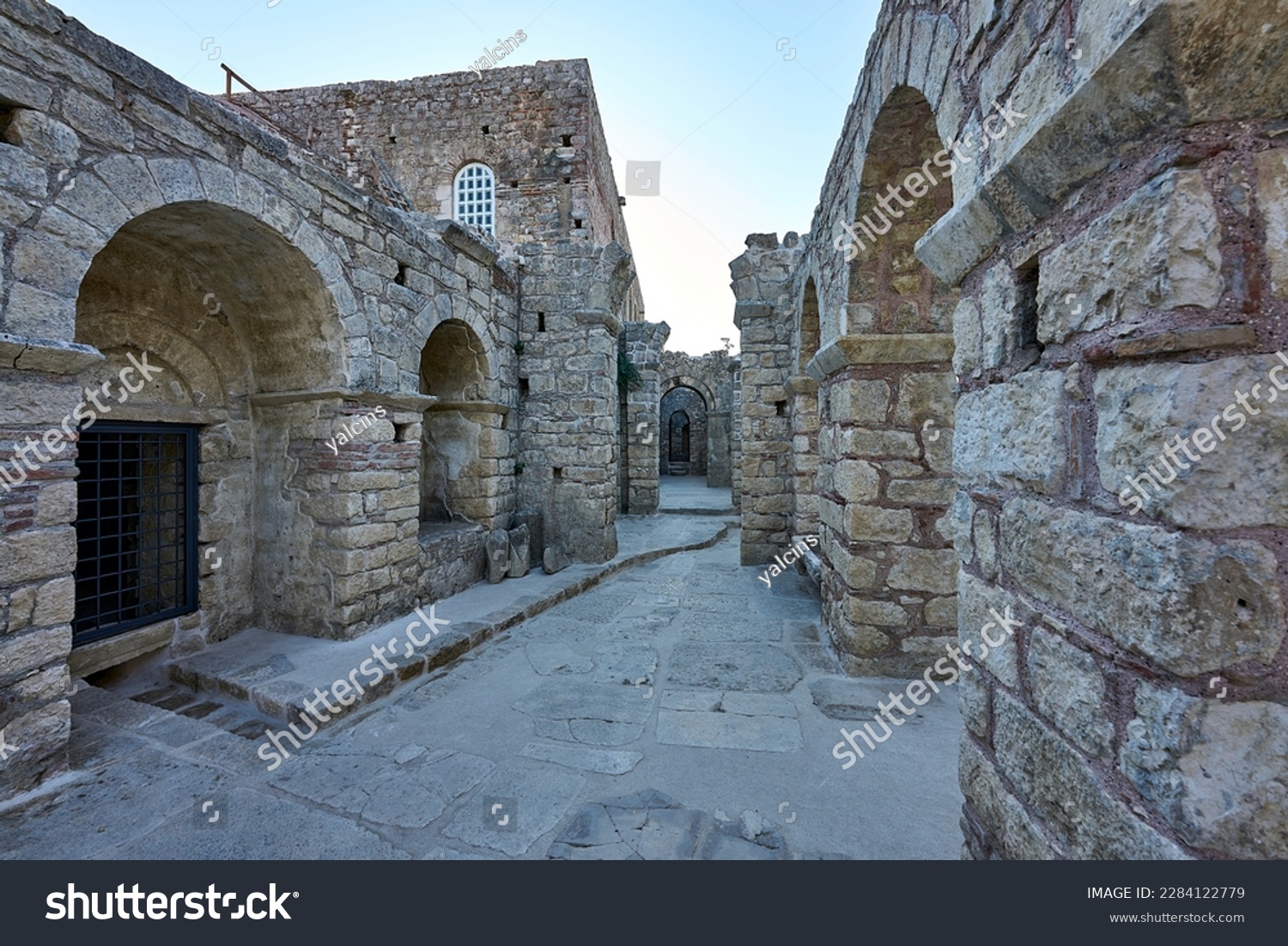 Exterior alley, walls, archs, ruins of  St. Nicholas Church (aka Santa Claus Church, Noel Baba Kilisesi), basilica church, ancient city of Myra, museum located in Demre, Antalya, Turkey #2284122779