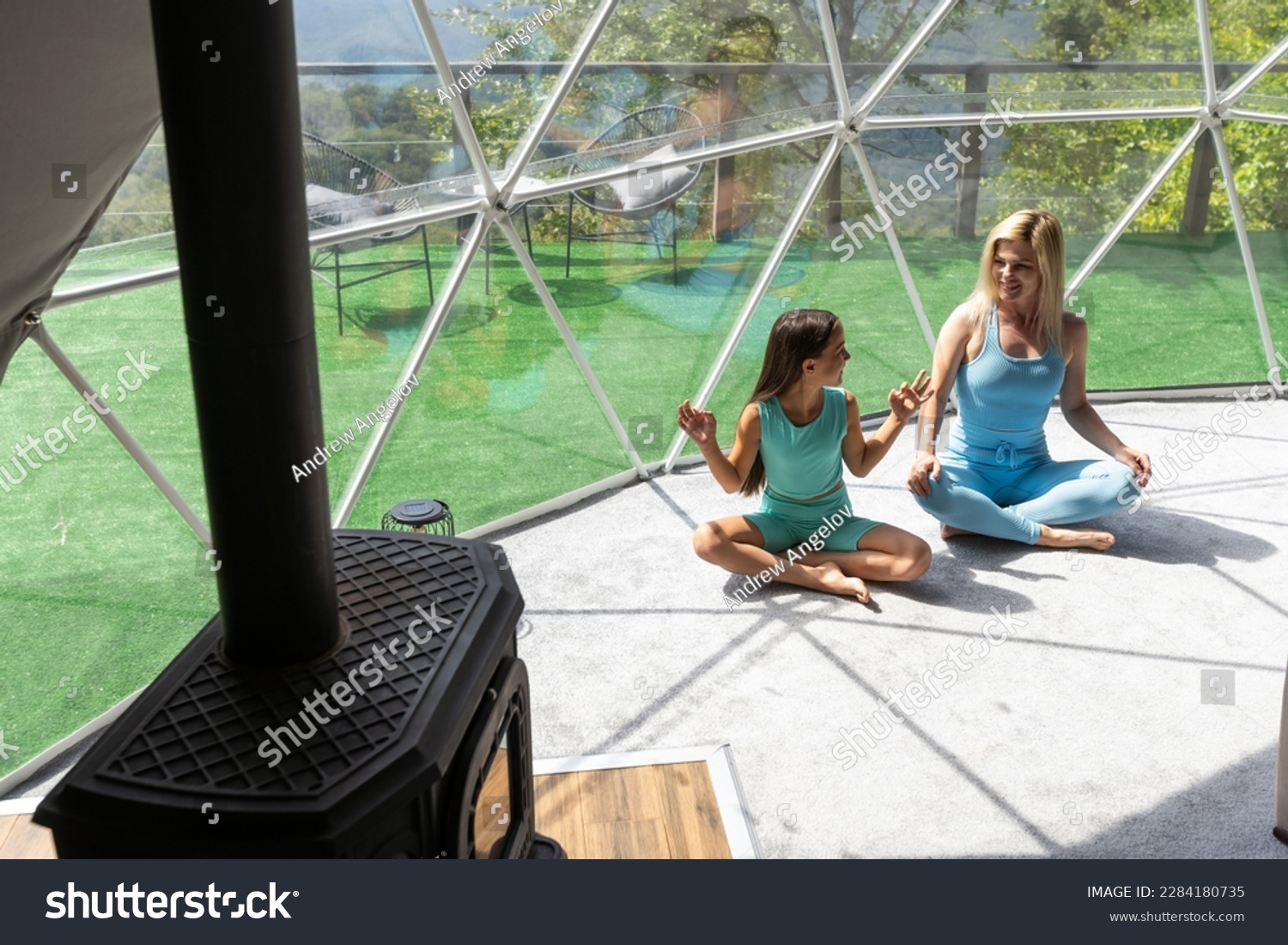 mother and daughter yoga in glamping dome tent domestic #2284180735