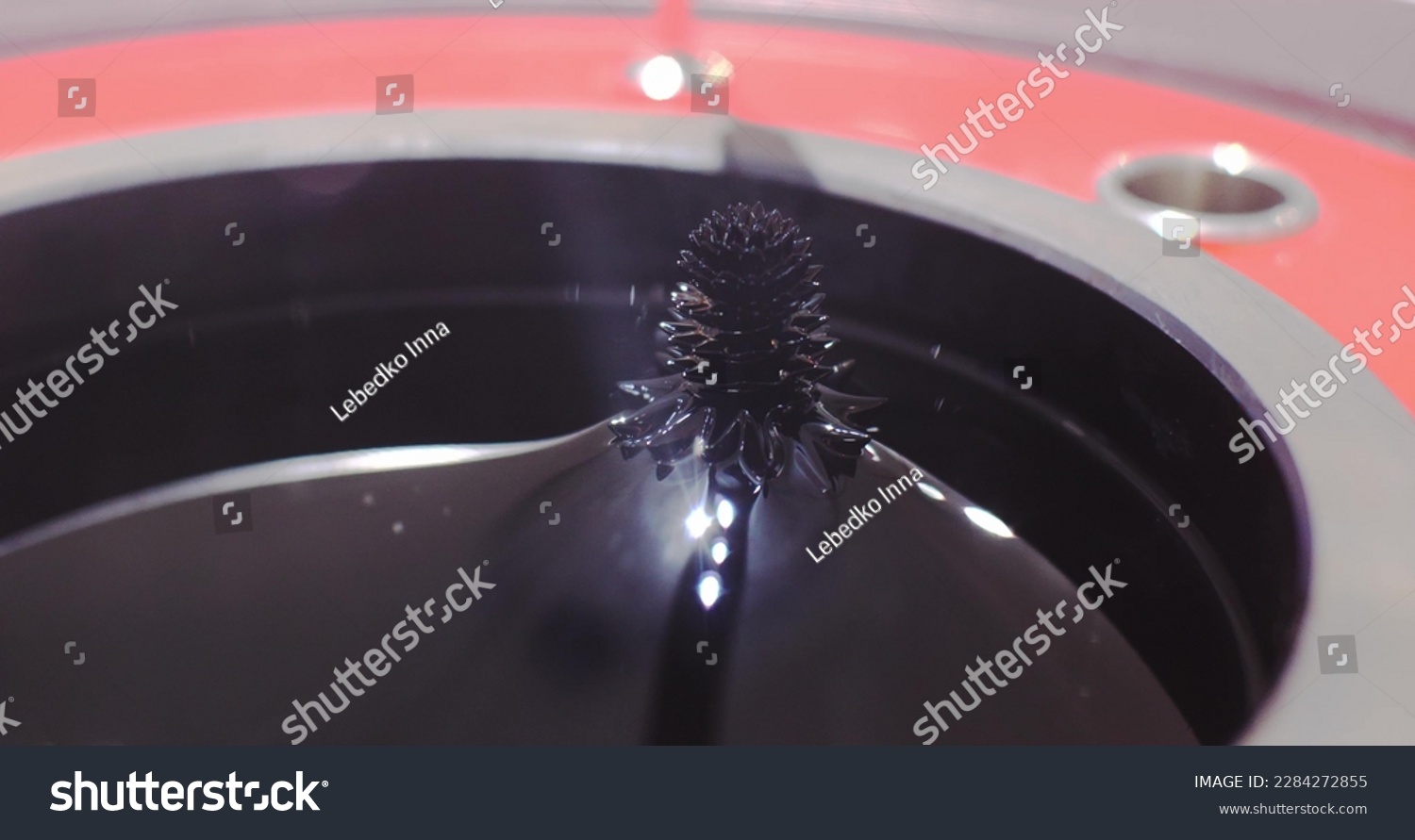 Experiment on the movement of a ferromagnetic black liquid under the action of a magnetic field. Ferrofluid takes on bizarre sharp shapes under the influence of a magnetic field. #2284272855