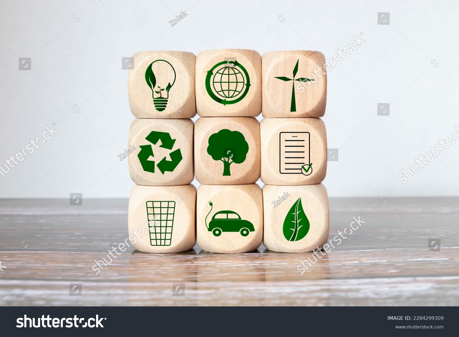 Green and eco building concept. wooden cubes with green building symbols on the natural background. LEED certification. Leadership in Energy and Environmental Design. Sustainable building. #2284299309