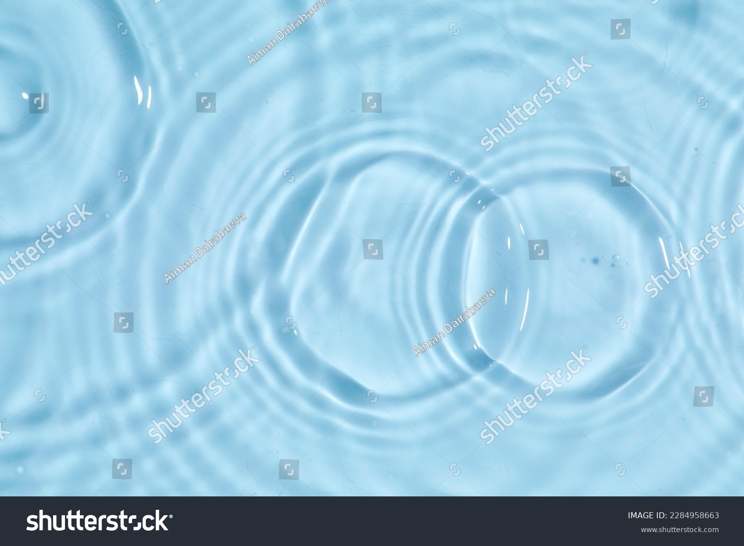 Blue water texture, blue water surface with rings and ripples. Spa concept background. Flat lay #2284958663