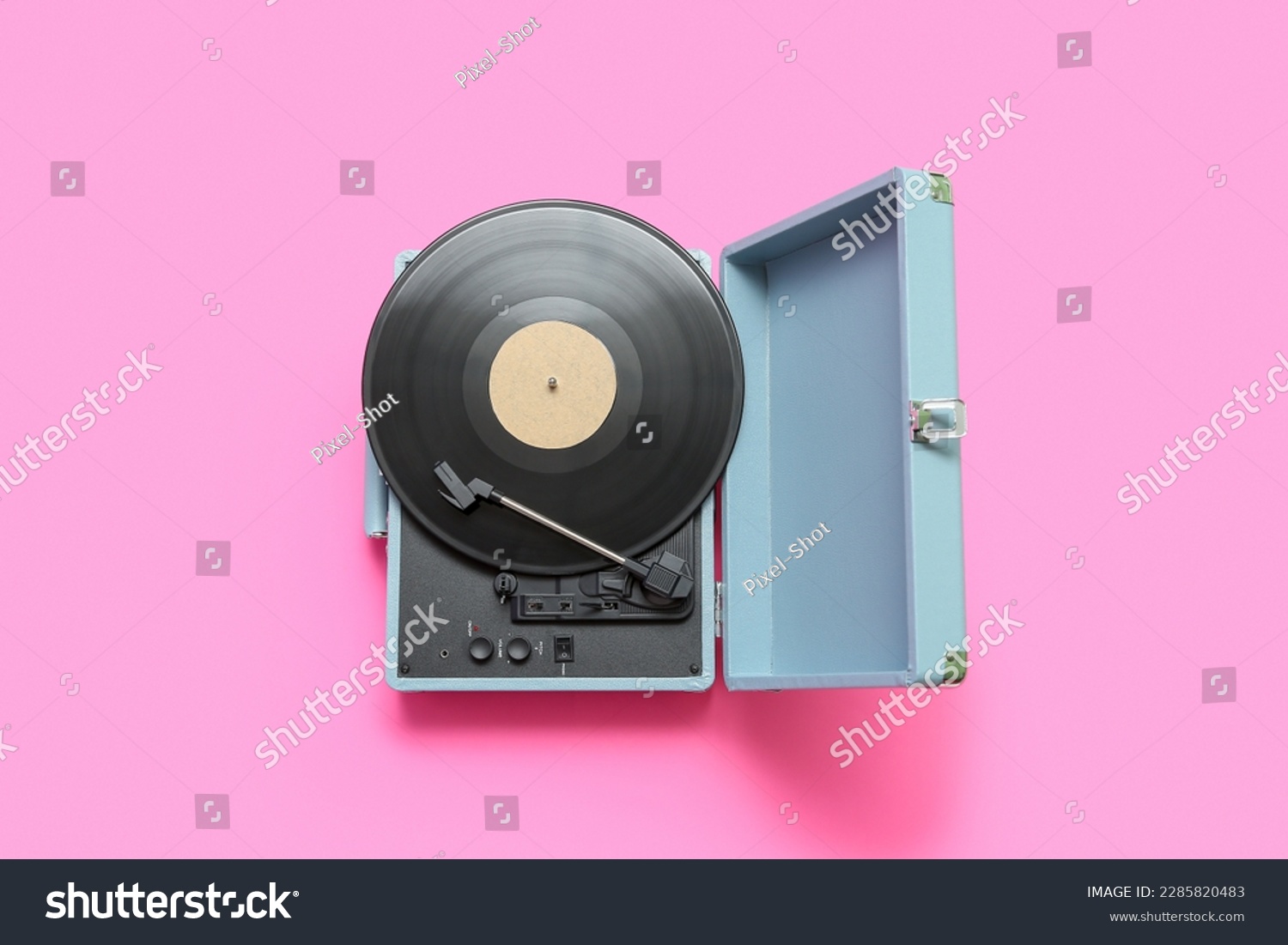 Record player with vinyl disk on pink background #2285820483