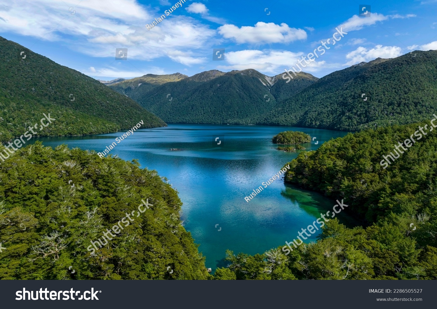 View of a beautiful mountain lake. Mountain lake view. Lake in mountain forest. Beautiful mountain lake landscape #2286505527