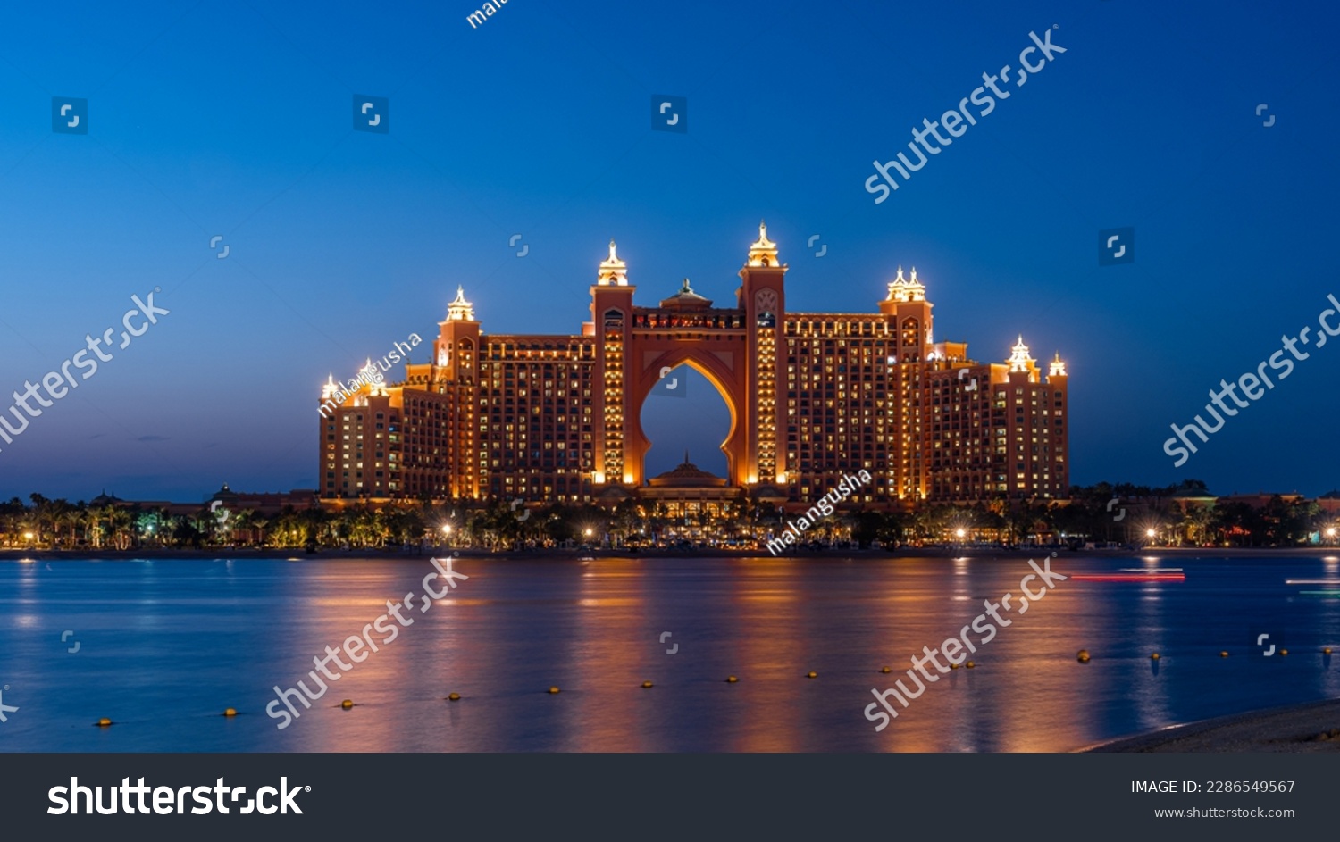 Experience the magic of Dubai's Atlantis hotel at night with our stunning landscape photograph. The iconic hotel, located on the man-made island of Palm Jumeirah #2286549567