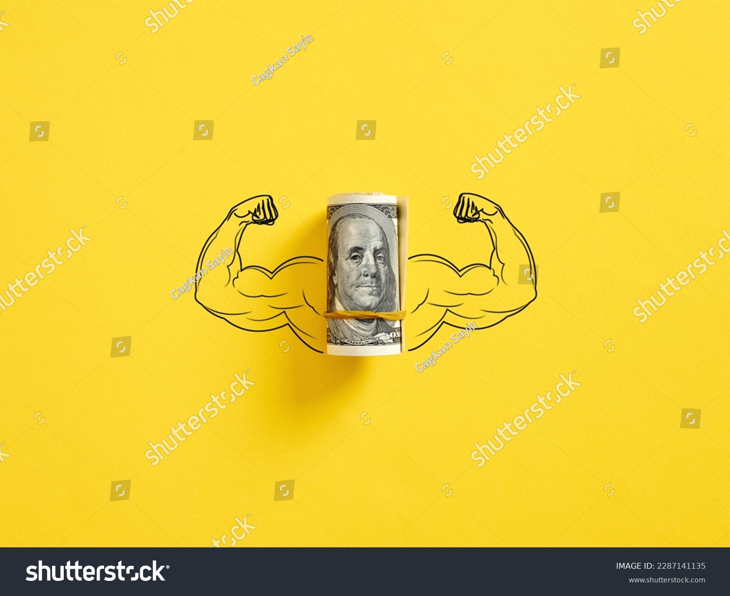 Bunch of United States dollar money with flexing muscle biceps on yellow background. Strong or highest currency concept. #2287141135