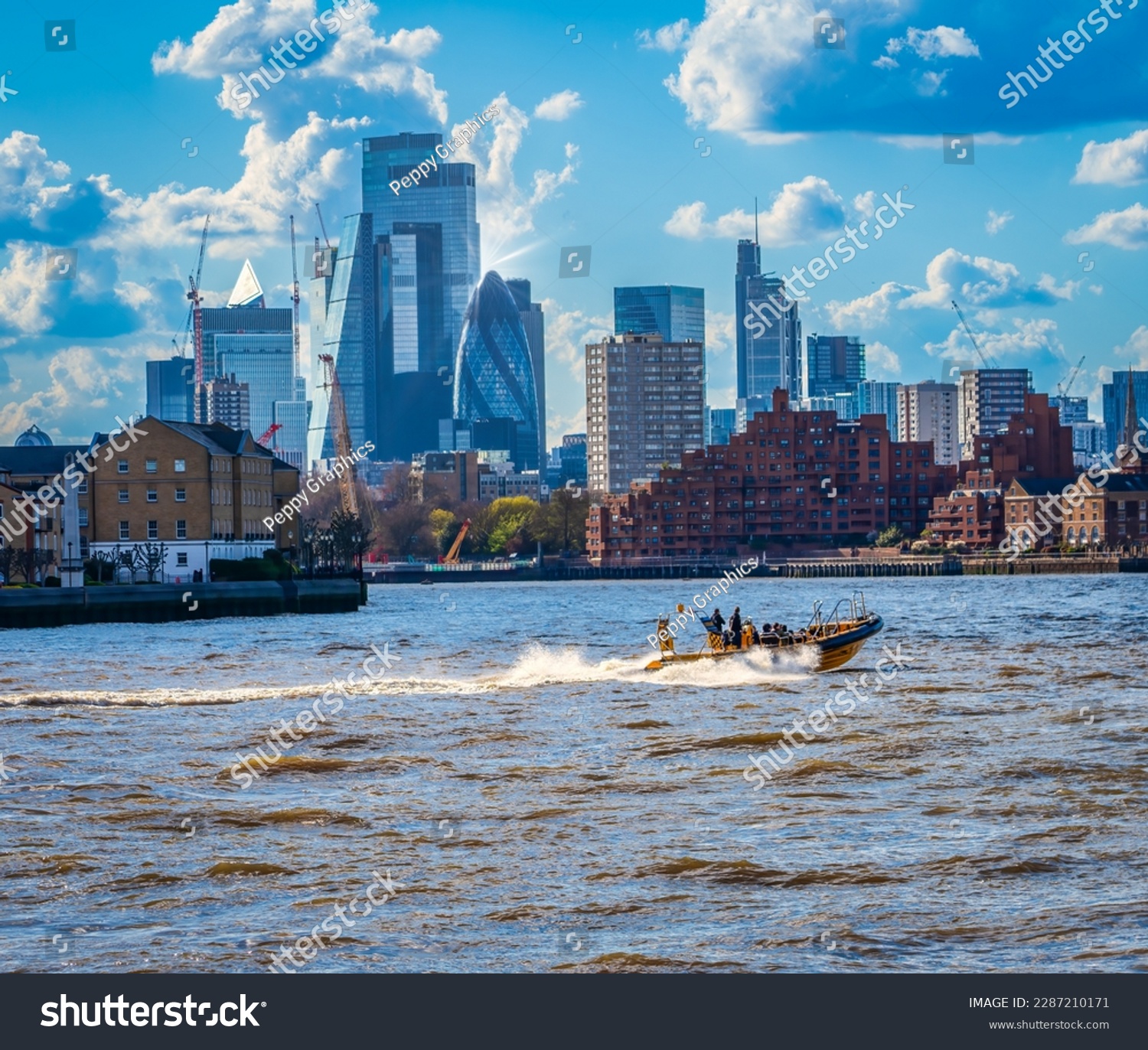 A speed boat on the Thames with central London buildings in the background  #2287210171
