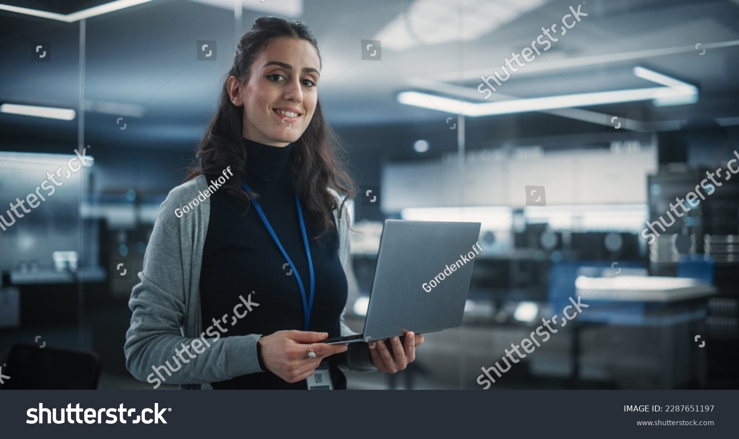 Portrait of a Young Attractive Empowered Multiethnic Woman Looking at Camera and Charmingly Smiling. Specialist at Work, Information Technology Manager, Software Engineering Professional #2287651197
