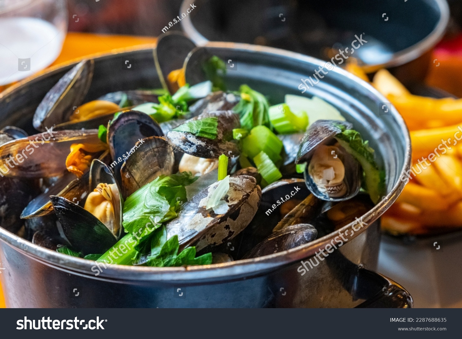 A closeup of a delicious steamed mussel casserole in a Belgian restaurant. Healthy food. #2287688635