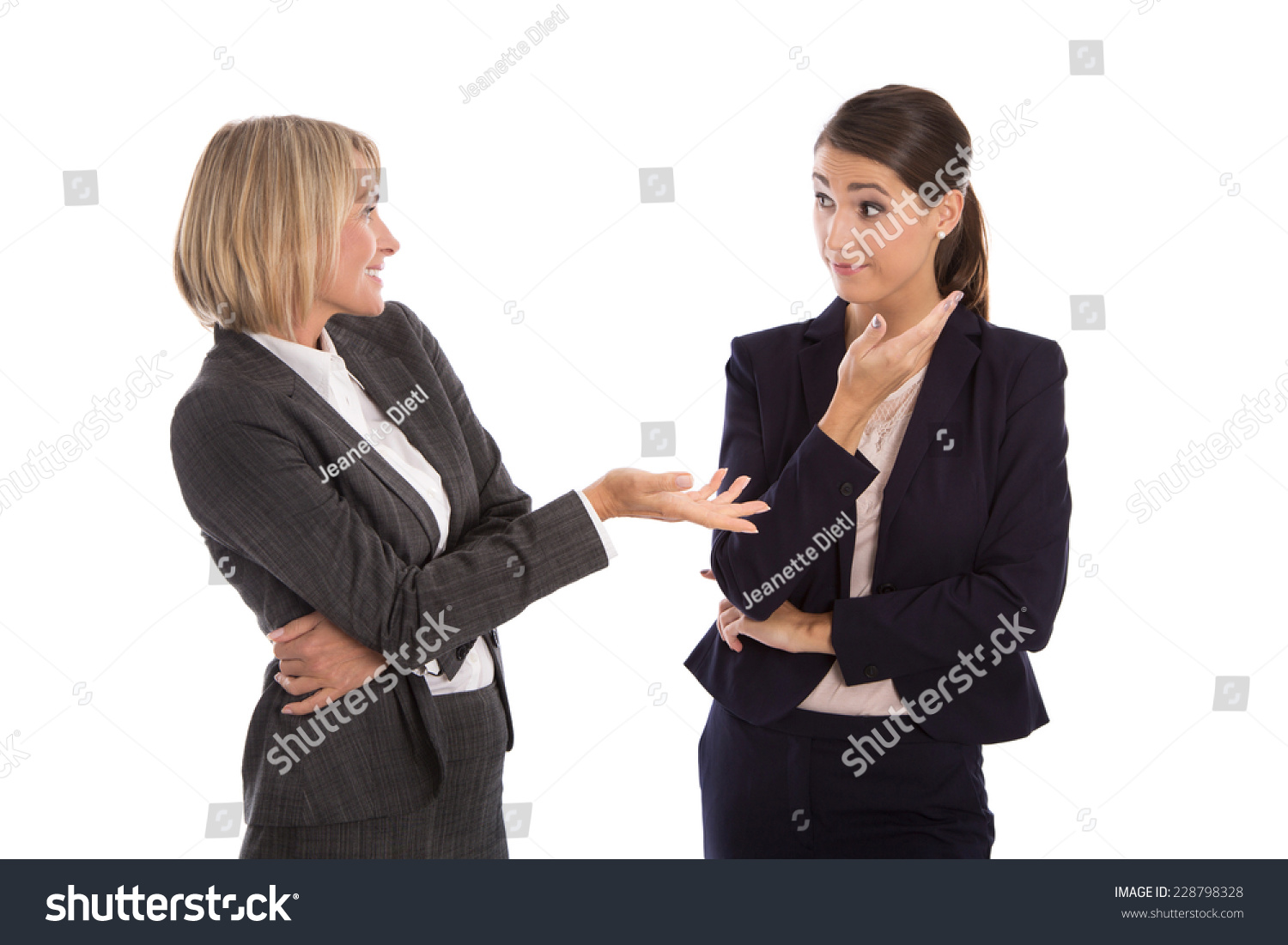 Two isolated businesswoman talking together: concept for body language. #228798328