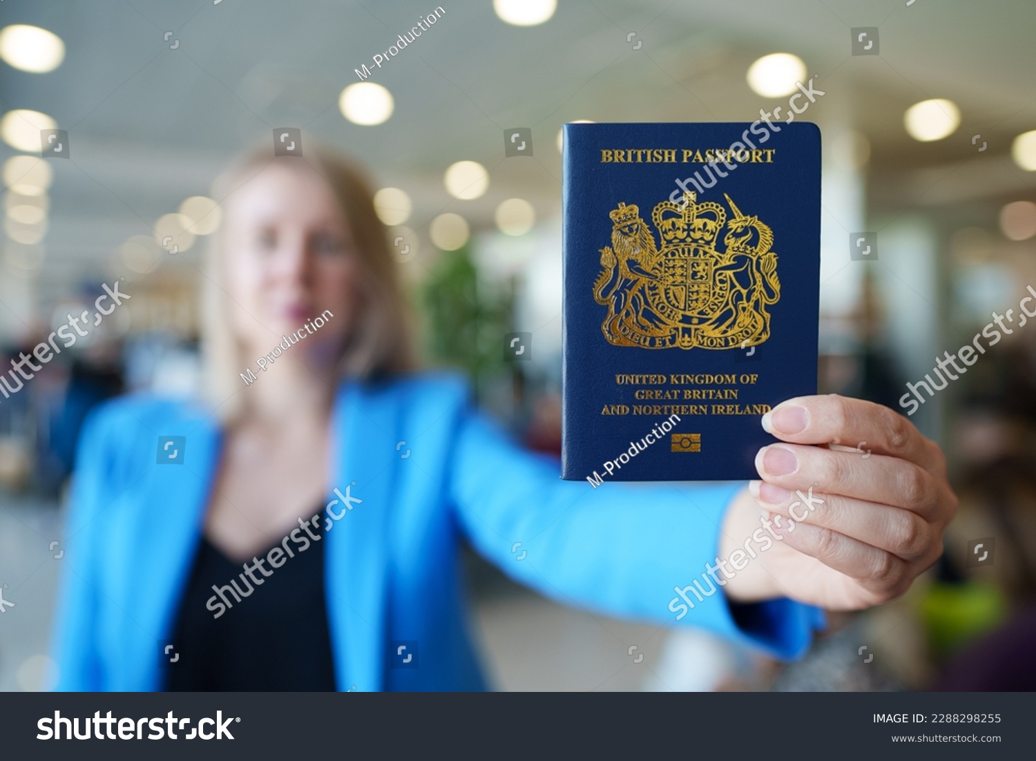 Woman showing passport of United Kingdom. #2288298255