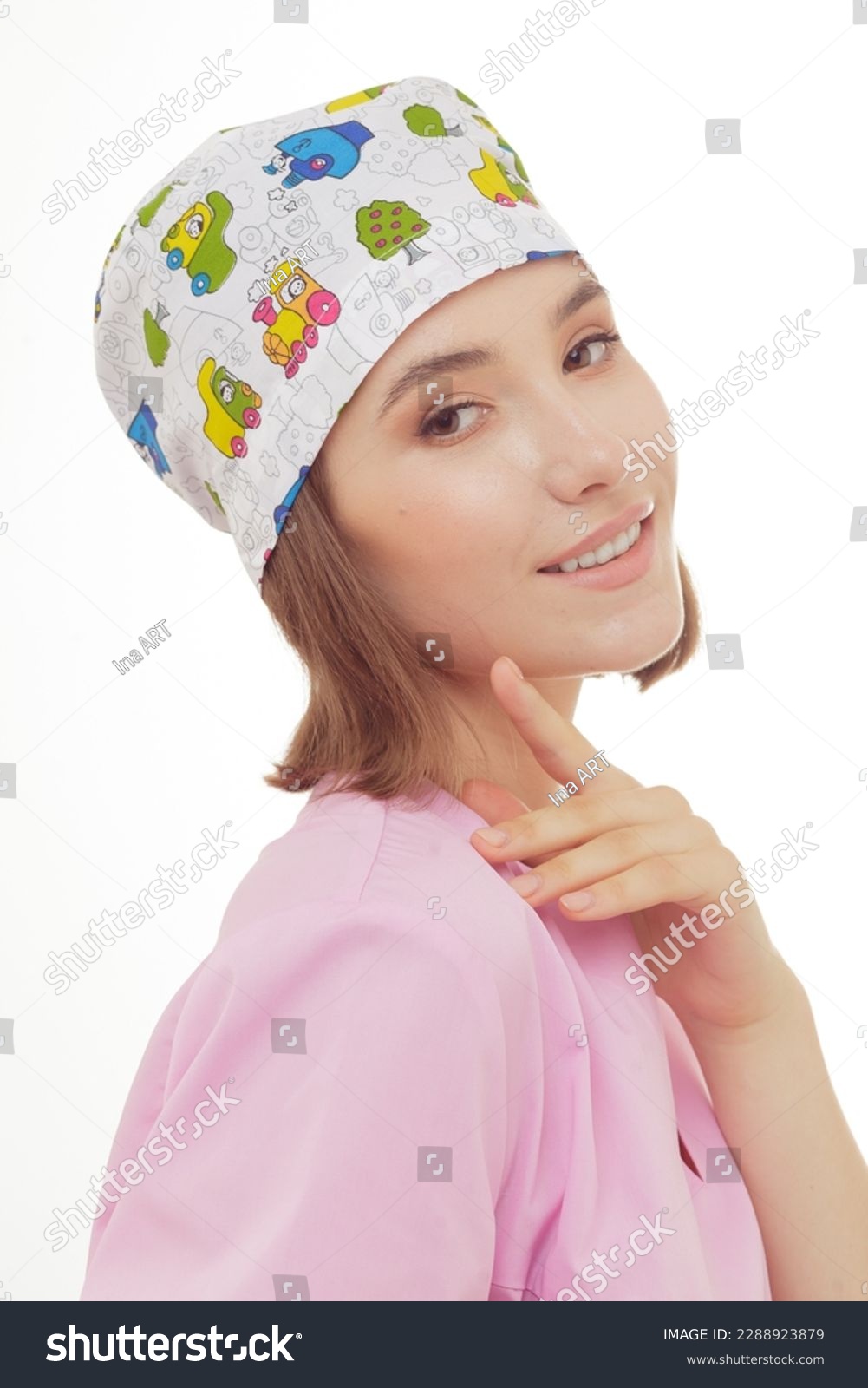 Catalog headshots of surgical scull hat, young female health professional posing on white background in studio. Kids Dentist headwear photo shoot. #2288923879